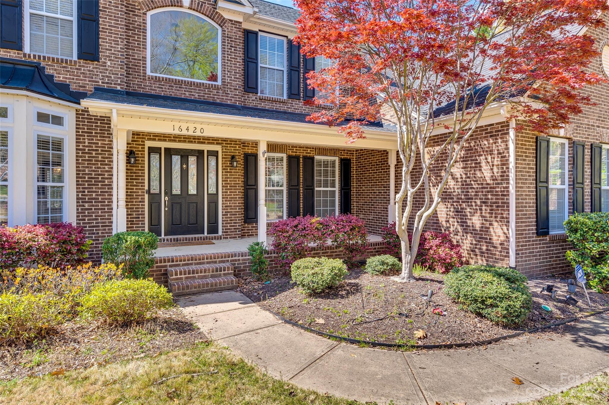 16420 Woolwine Road Charlotte, NC 28278 - Photo 34 of 41 front view of a brick house with a large windows