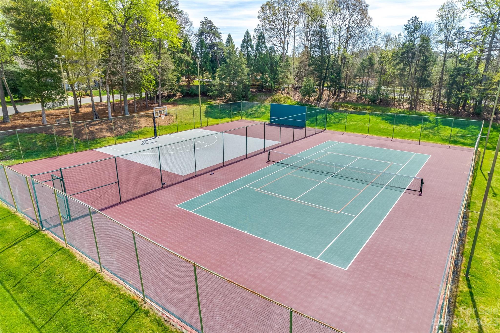 16420 Woolwine Road Charlotte, NC 28278 - Photo 39 of 41 a view of a tennis ground with large trees