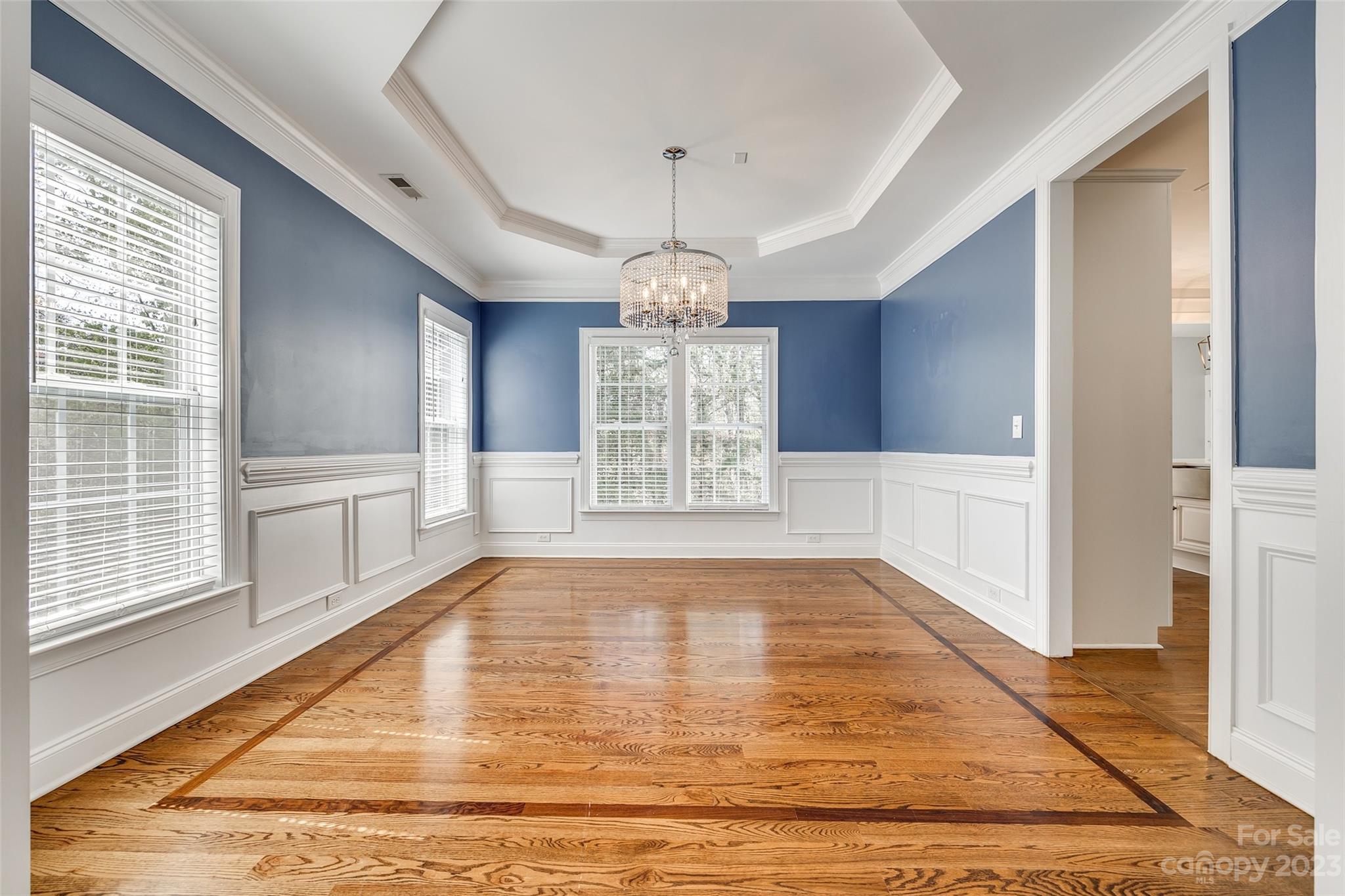 16420 Woolwine Road Charlotte, NC 28278 - Photo 4 of 41 a view of an empty room with wooden floor and a window