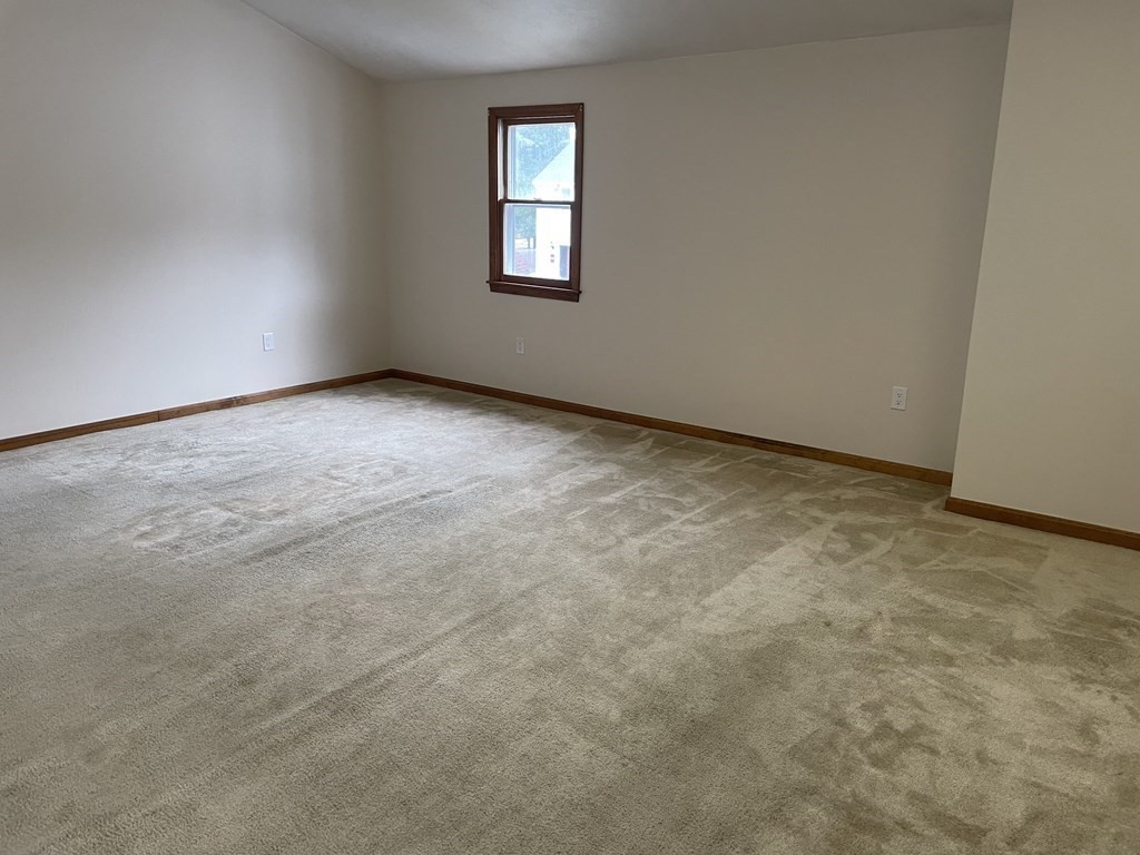 811 Washington Street, Unit 9 Pembroke, MA 02359 - Photo 6 of 10 an empty room with a window
