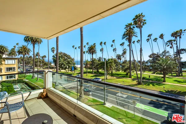 a view of swimming pool with a garden and outdoor seating