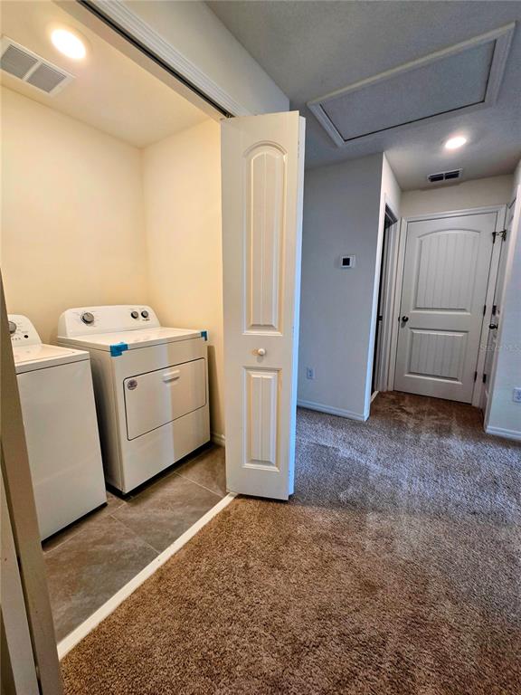 17101 Water Spring Boulevard Winter Garden, FL 34787 - Photo 11 of 29 a view of utility room with washer and dryer