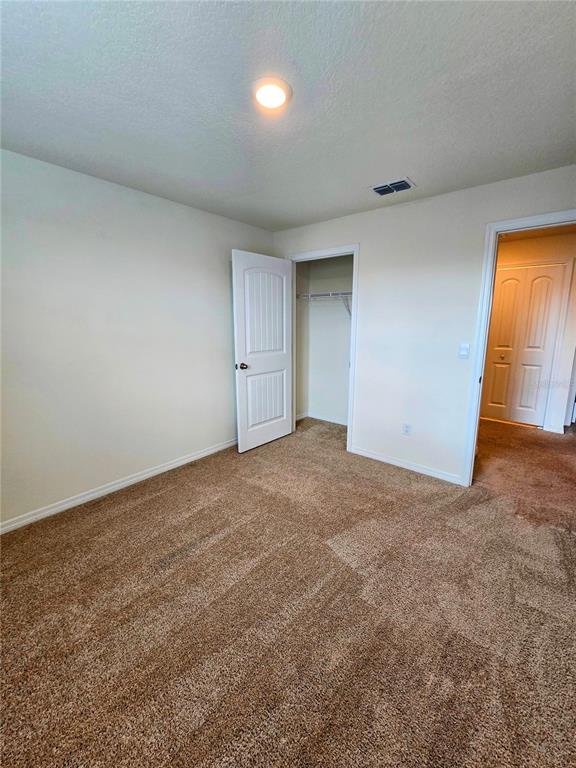 17101 Water Spring Boulevard Winter Garden, FL 34787 - Photo 14 of 29 a view of an empty room and a window