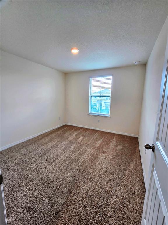 17101 Water Spring Boulevard Winter Garden, FL 34787 - Photo 15 of 29 an empty room with windows