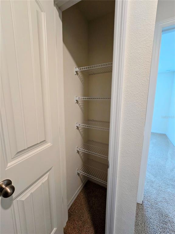 17101 Water Spring Boulevard Winter Garden, FL 34787 - Photo 17 of 29 a bathroom with a glass door shower