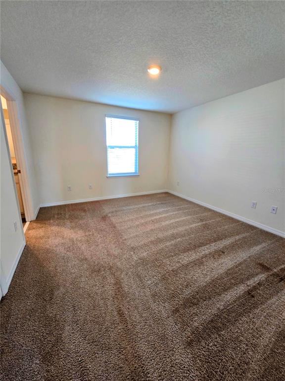 17101 Water Spring Boulevard Winter Garden, FL 34787 - Photo 20 of 29 an empty room with a window