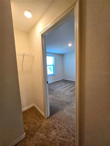 a bathroom with a granite countertop sink a mirror and shower