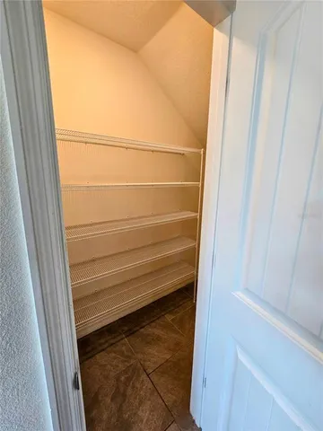 an empty room with a wooden door