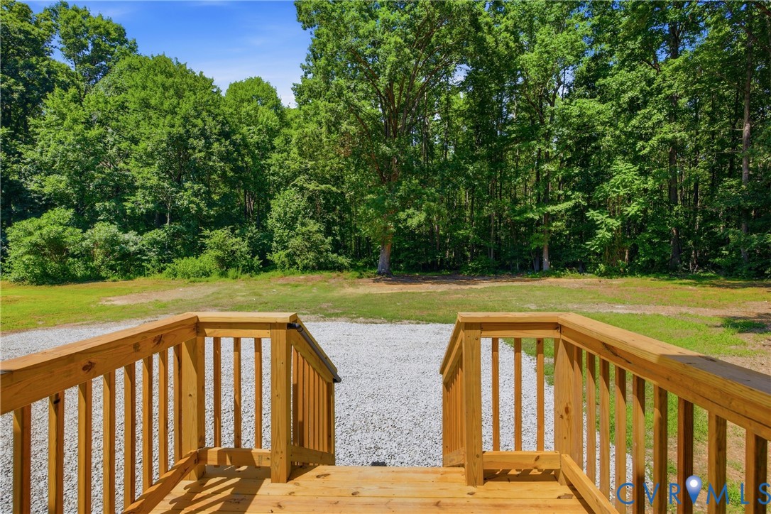 3497 Bumpass Road Beaverdam, VA 23015 - Photo 18 of 28 Wood deck with natural finish and railings opening