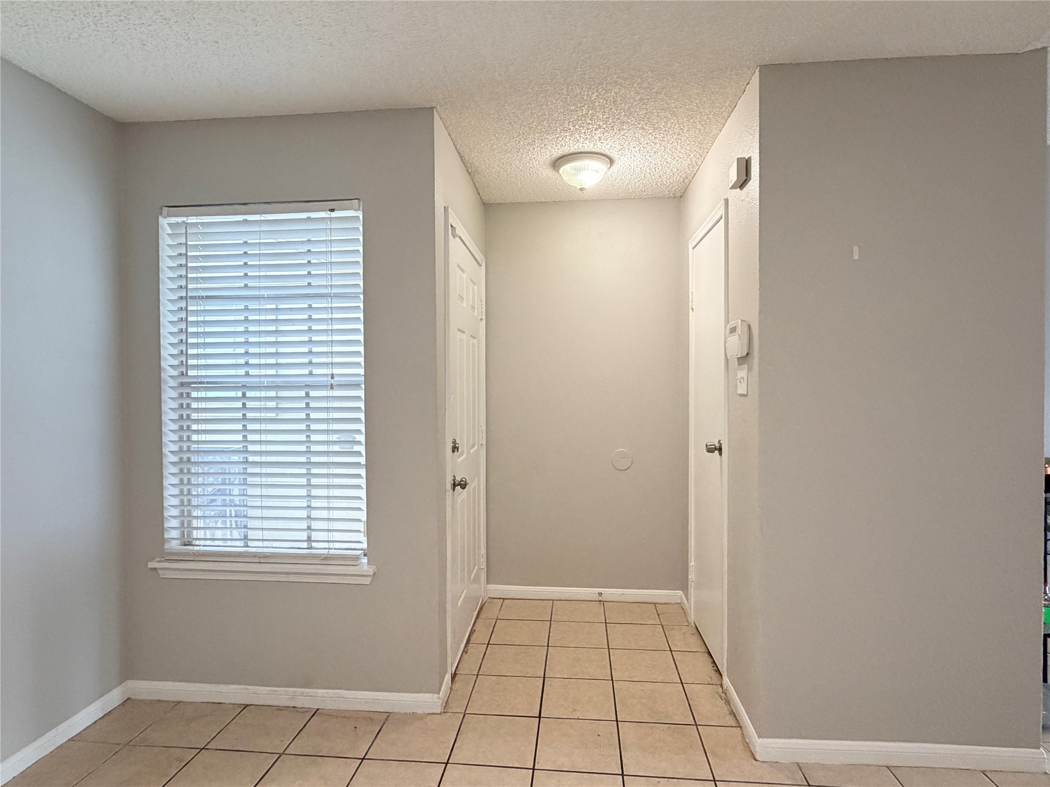 10101 South Gessner Road, Unit 515 Houston, TX 77071 - Photo 2 of 10 a view of an empty room with window and closet area