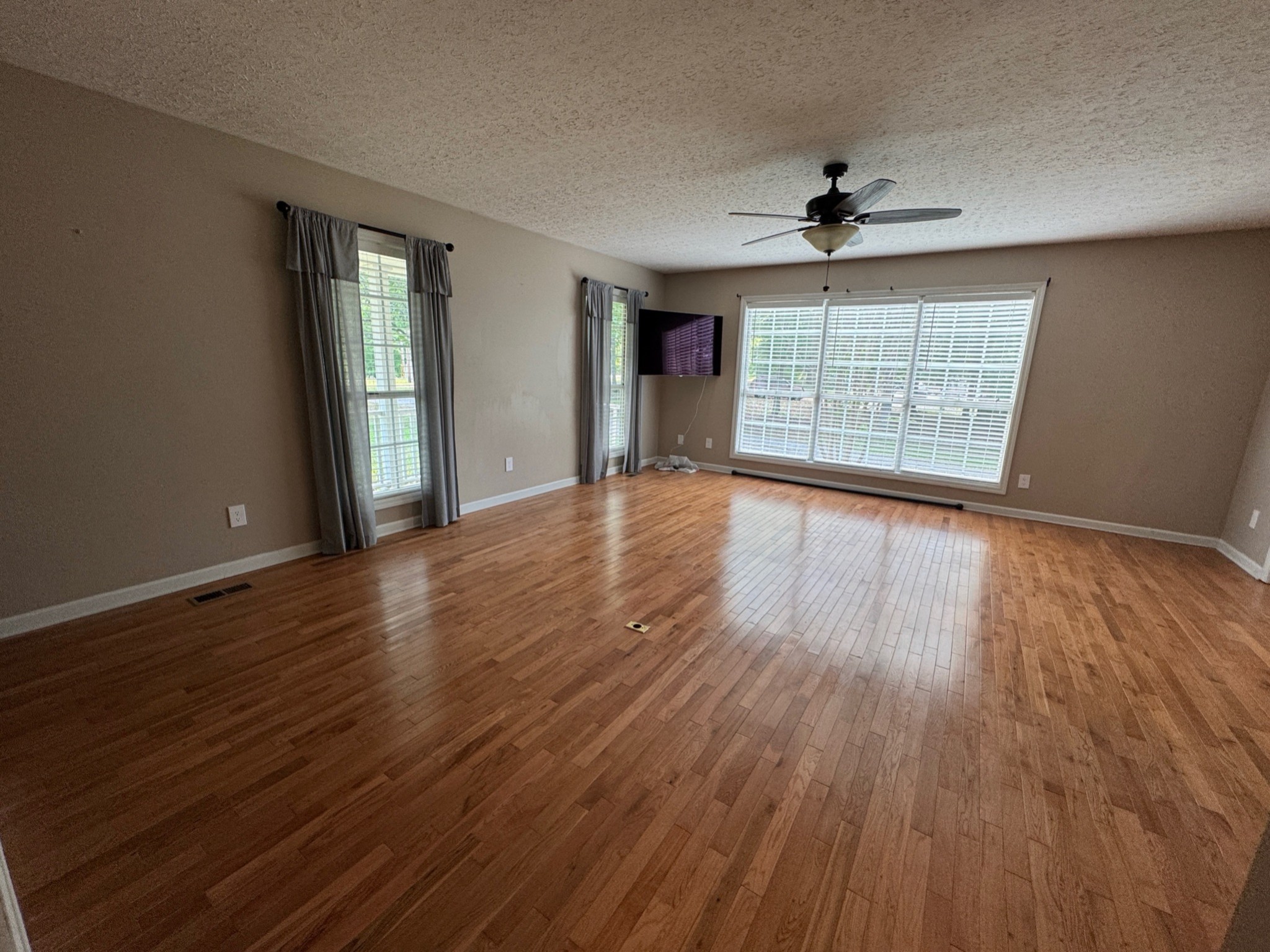 3594 Oak Grove Road Red Boiling Springs, TN 37150 - Photo 18 of 33 a view of an empty room with wooden floor and a window