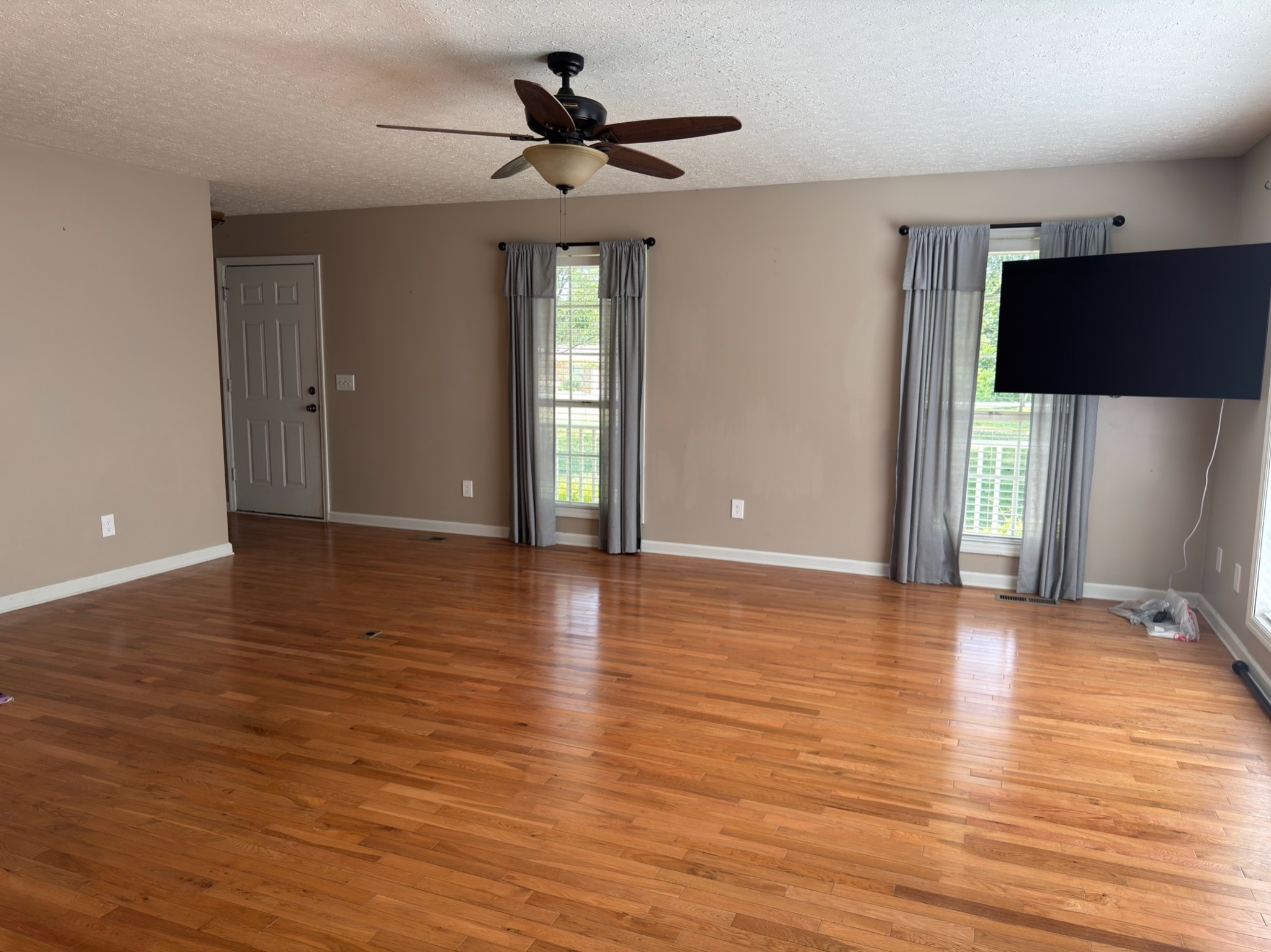 3594 Oak Grove Road Red Boiling Springs, TN 37150 - Photo 19 of 33 a view of an empty room with wooden floor and a window