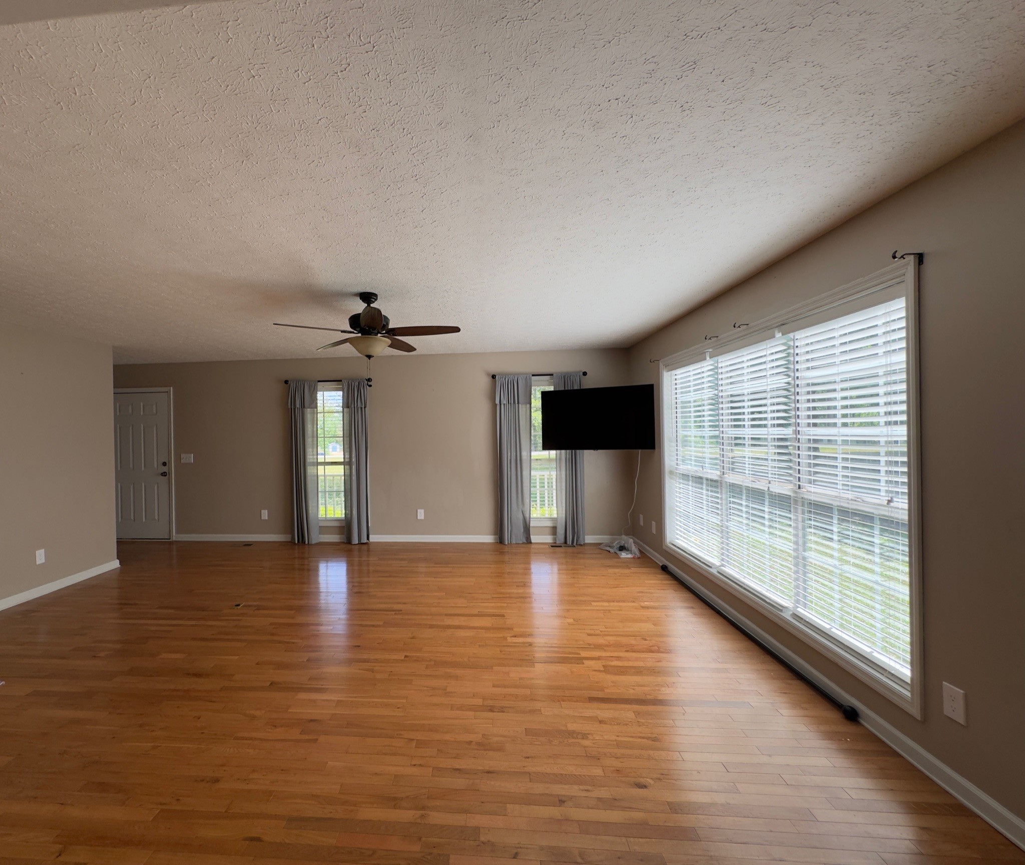 3594 Oak Grove Road Red Boiling Springs, TN 37150 - Photo 20 of 33 a view of an empty room with window and wooden floor