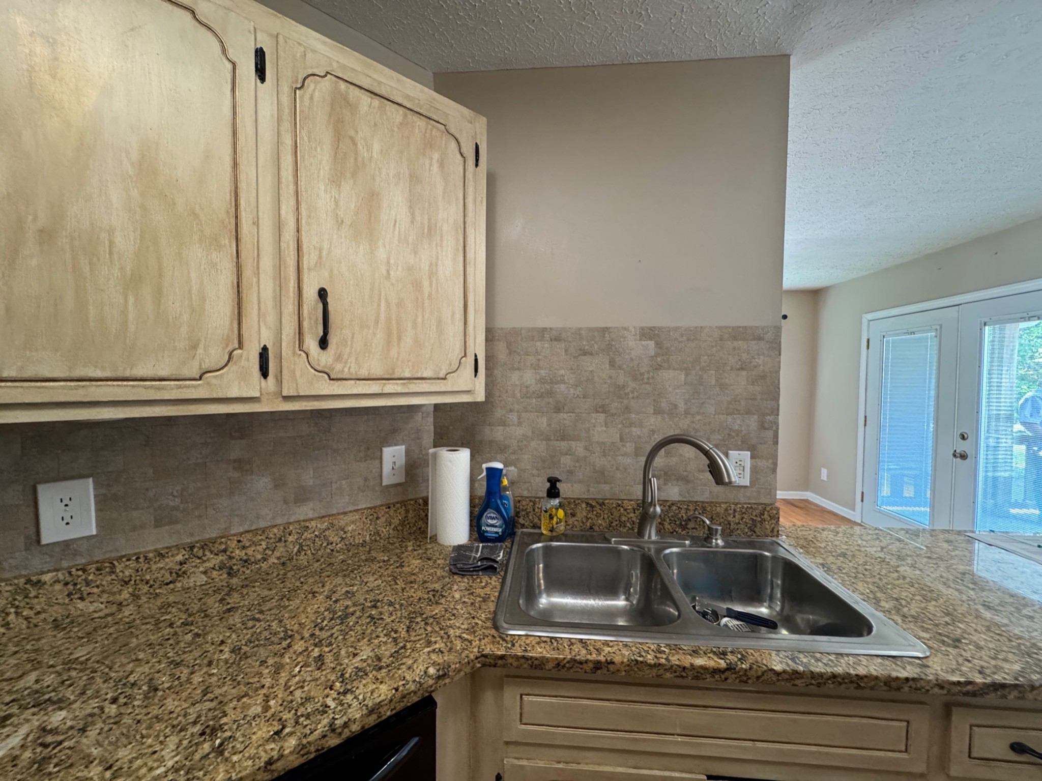 3594 Oak Grove Road Red Boiling Springs, TN 37150 - Photo 31 of 33 a kitchen with granite countertop a sink and cabinets
