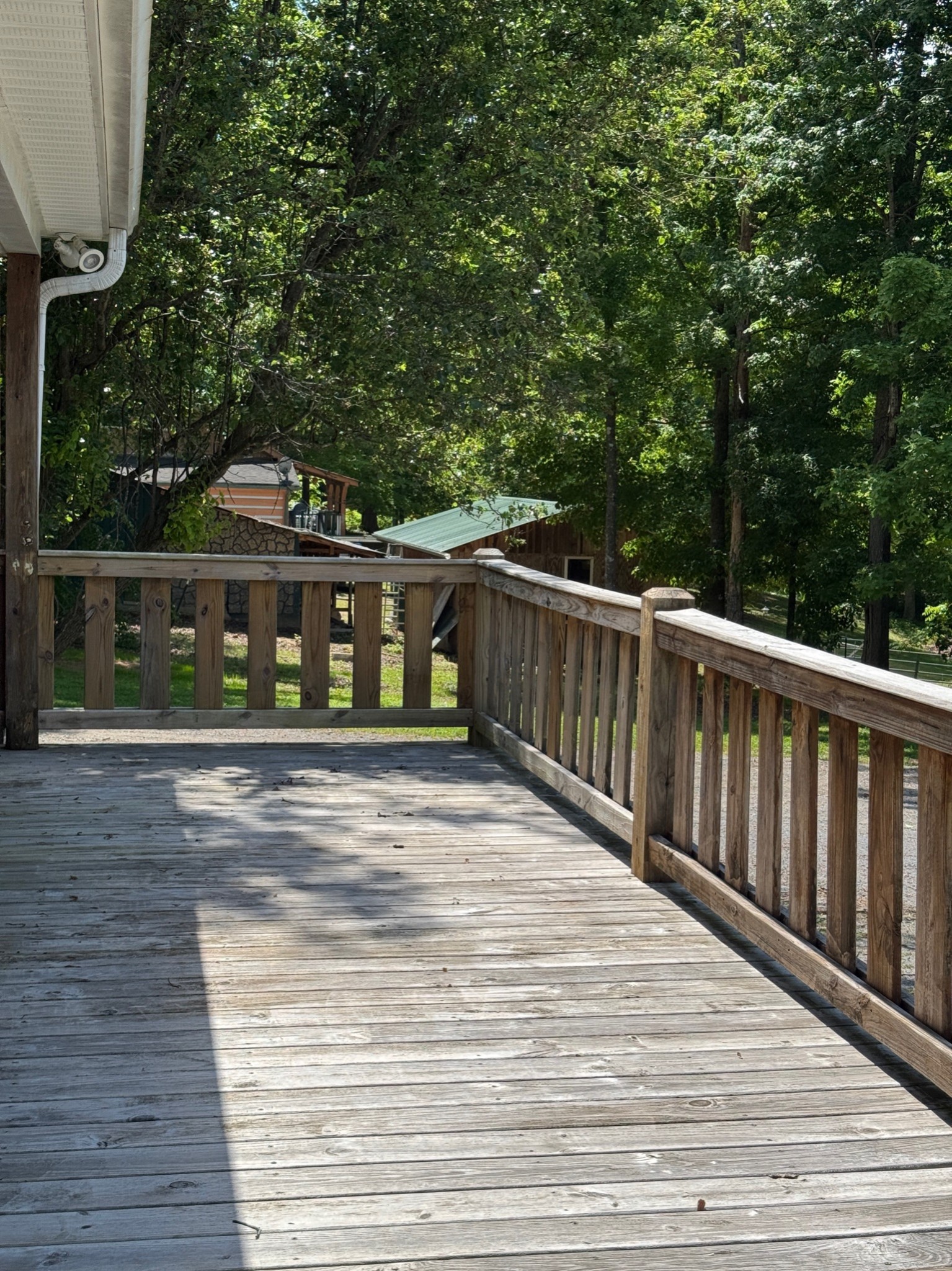 3594 Oak Grove Road Red Boiling Springs, TN 37150 - Photo 6 of 33 a balcony with wooden floor and outdoor space