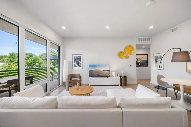 a living room with furniture and window