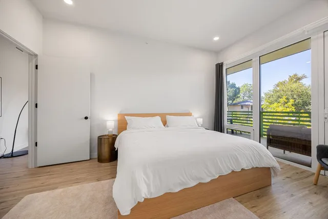a bathroom with a double vanity sink mirror and shower