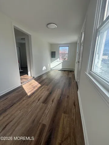 a view of entryway with wooden floor