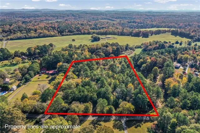 an aerial view of a houses and city street