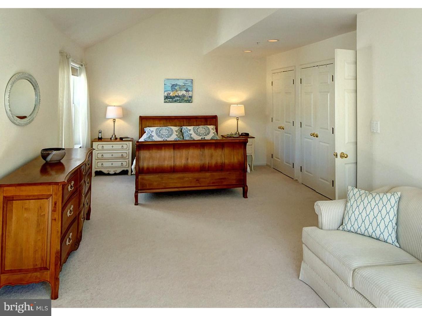 1113 Brian's Way Wayne, PA 19087 - Photo 12 of 25 a bedroom with a bed couch and mirror