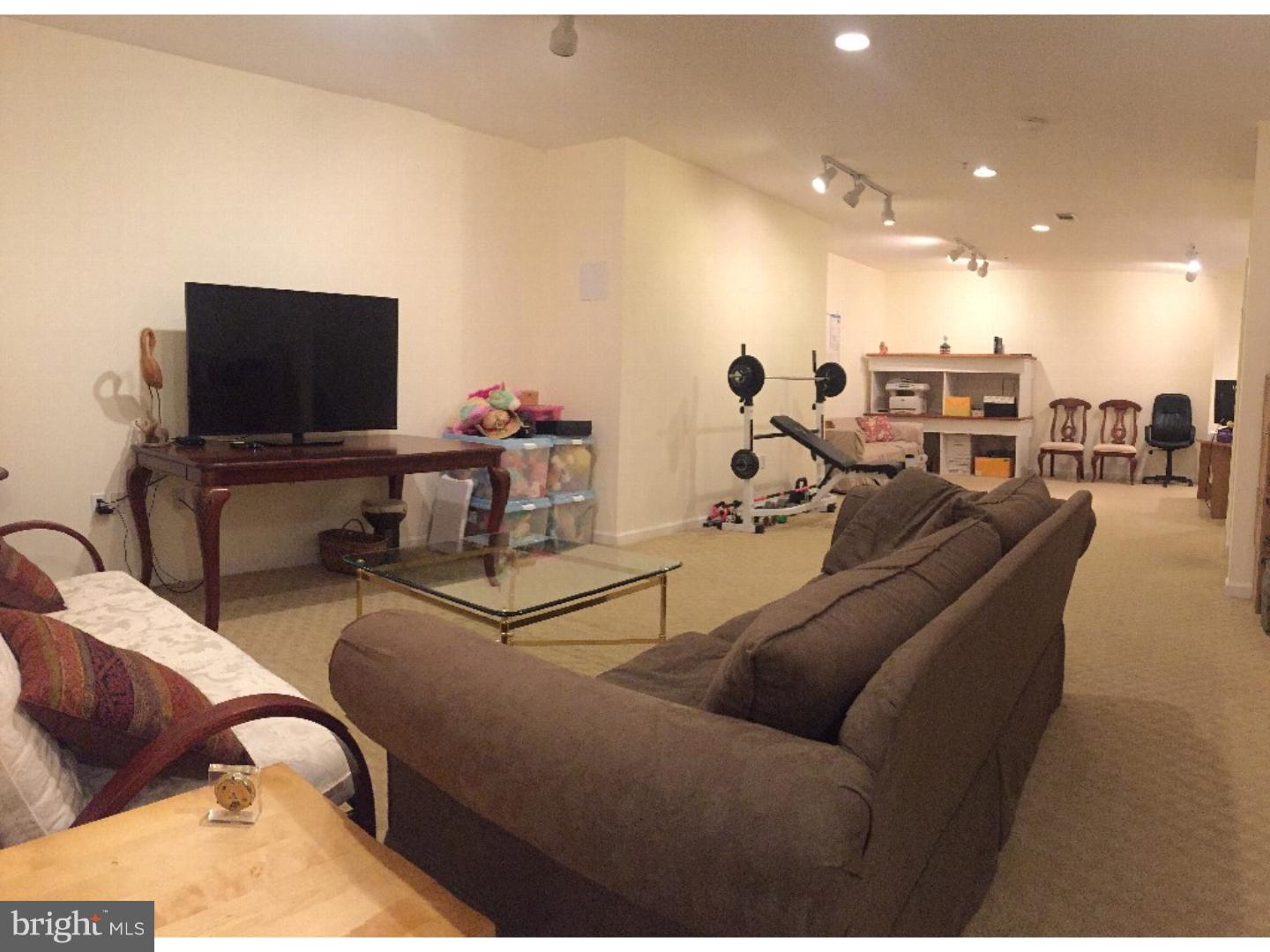 1113 Brian's Way Wayne, PA 19087 - Photo 16 of 25 a living room with furniture and a flat screen tv