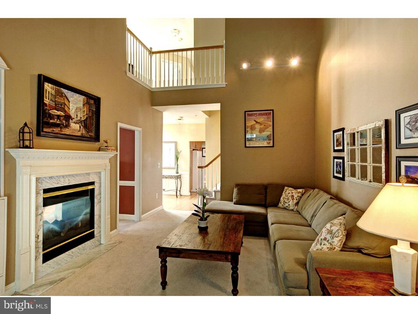 1113 Brian's Way Wayne, PA 19087 - Photo 5 of 25 a living room with furniture a fireplace and a flat screen tv