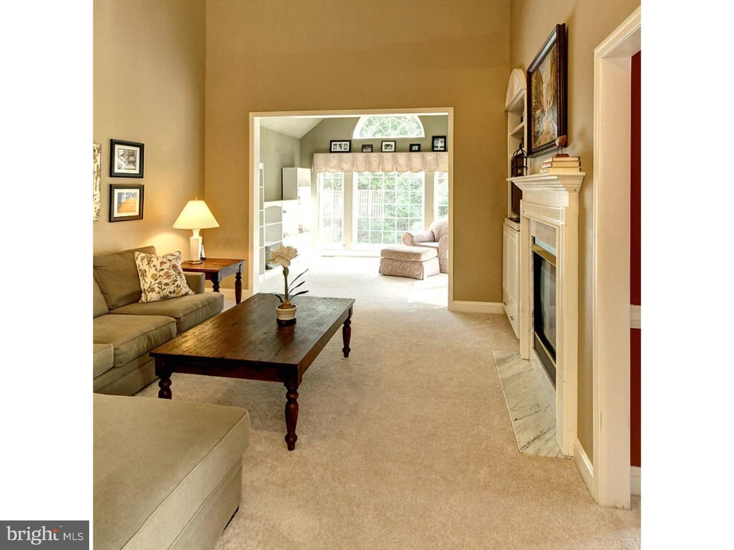 1113 Brian's Way Wayne, PA 19087 - Photo 6 of 25 a living room with furniture and a fireplace