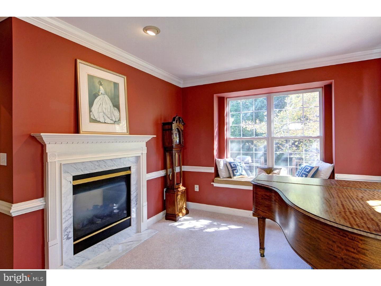 1113 Brian's Way Wayne, PA 19087 - Photo 7 of 25 a living room with furniture a fireplace and a large window