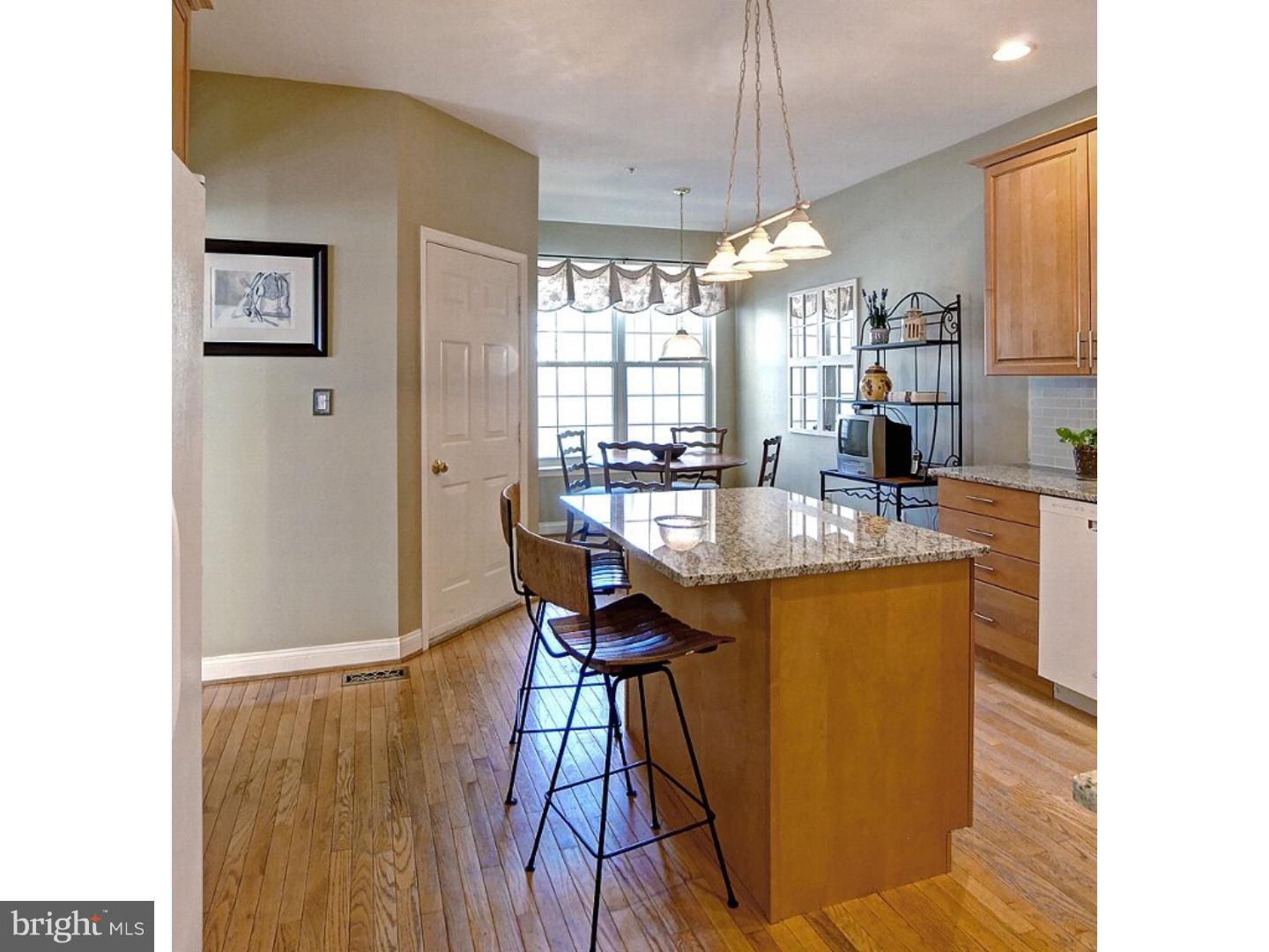 1113 Brian's Way Wayne, PA 19087 - Photo 10 of 25 a dining hall with stainless steel appliances granite countertop a sink and a refrigerator