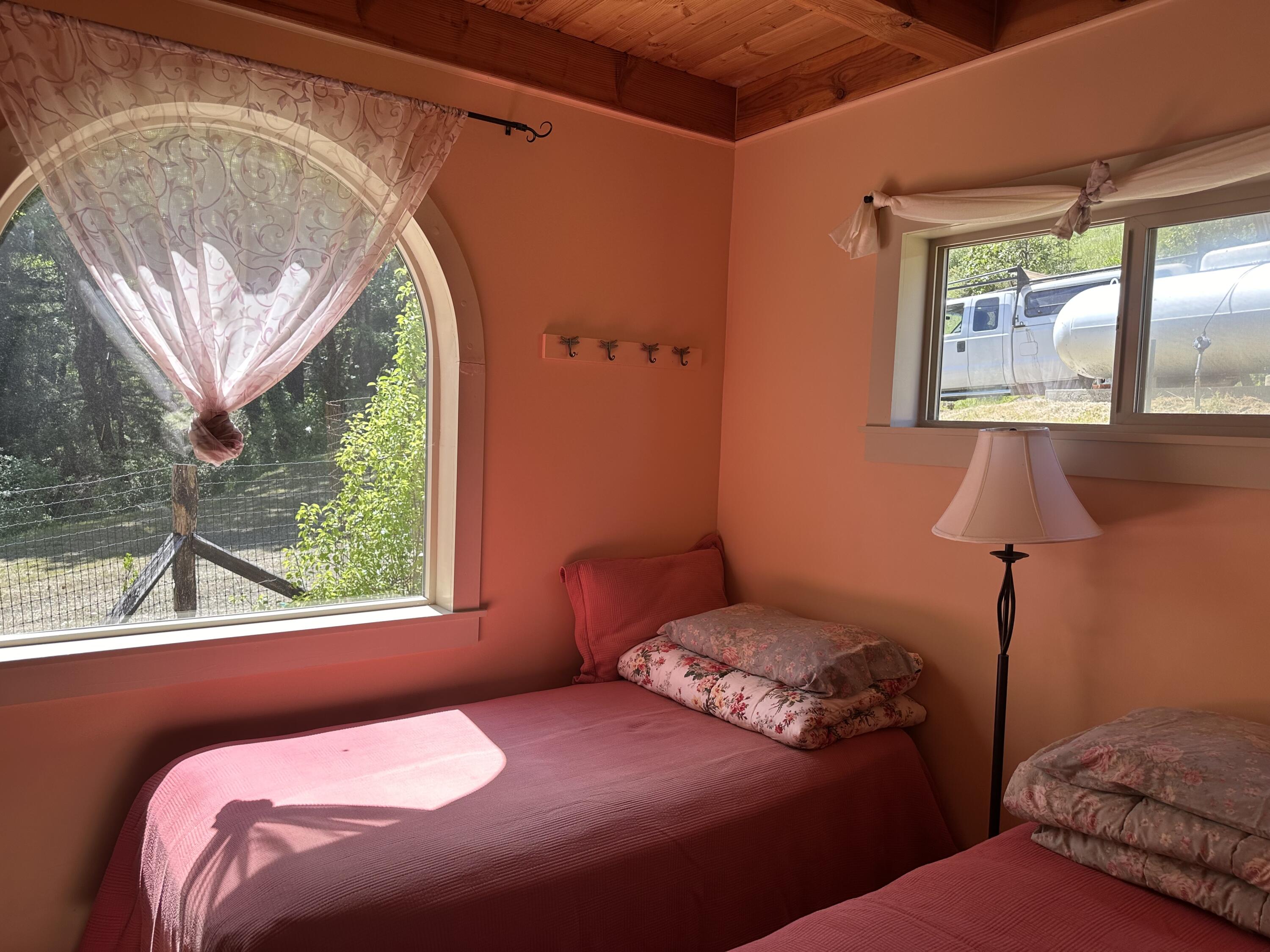 83000 Milstead Road Garberville, CA 95542 - Photo 18 of 67 a bedroom with a bed and a window