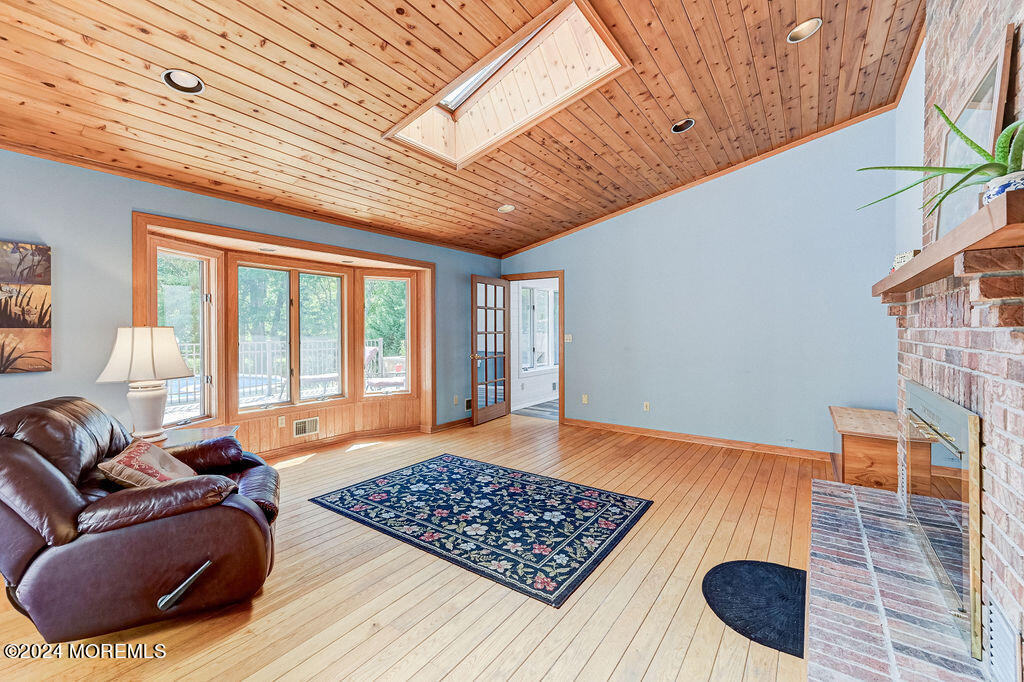 290 Easy Street Howell, NJ 07731 - Photo 13 of 43 a living room with furniture rug and a large window