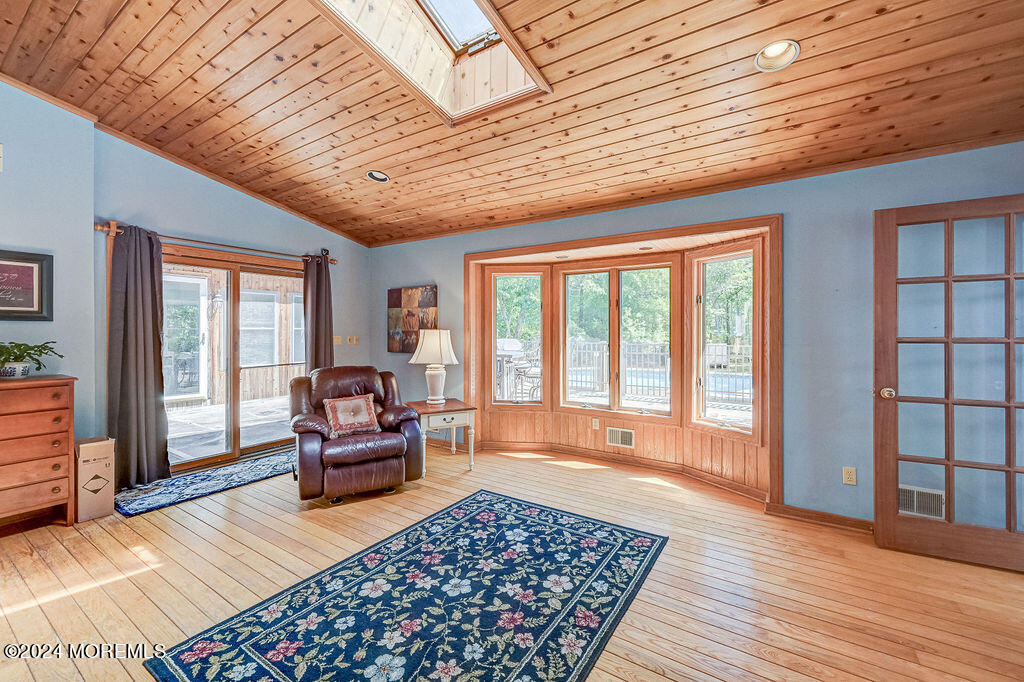 290 Easy Street Howell, NJ 07731 - Photo 15 of 43 a living room with furniture and a wooden floor