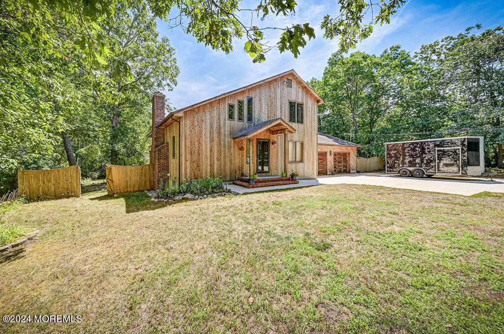 290 Easy Street Howell, NJ 07731 - Photo 2 of 43 a house with trees in front of it