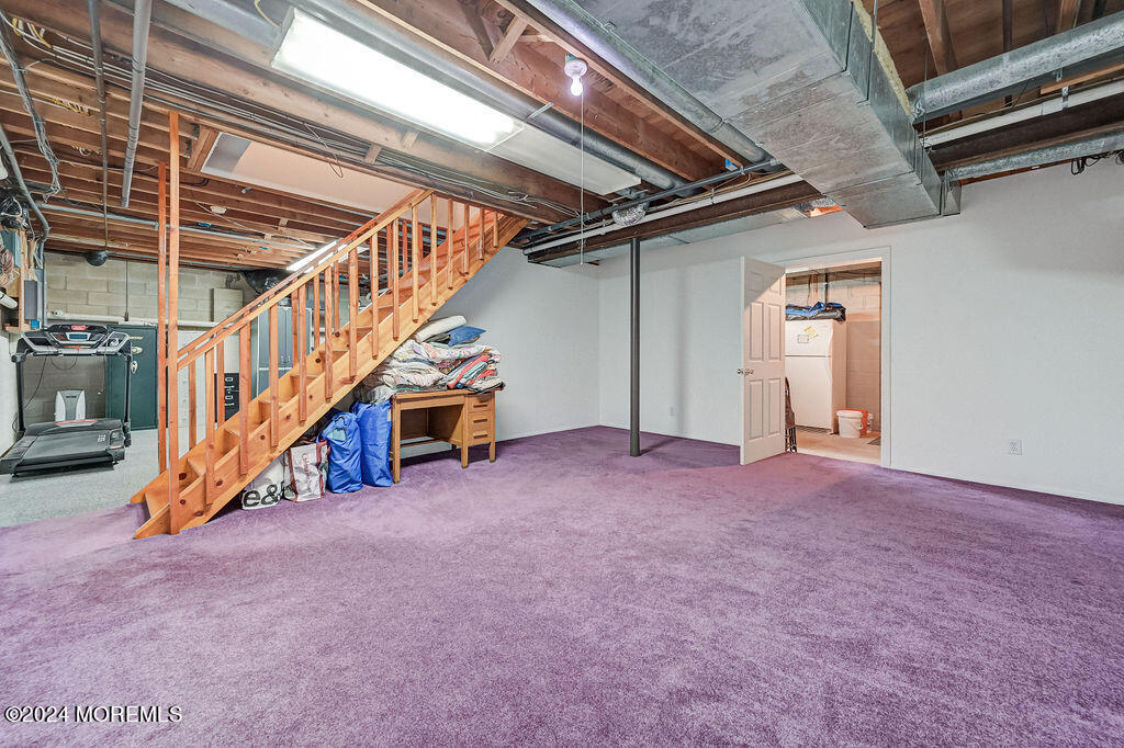 290 Easy Street Howell, NJ 07731 - Photo 22 of 43 a view of an empty room with stairs