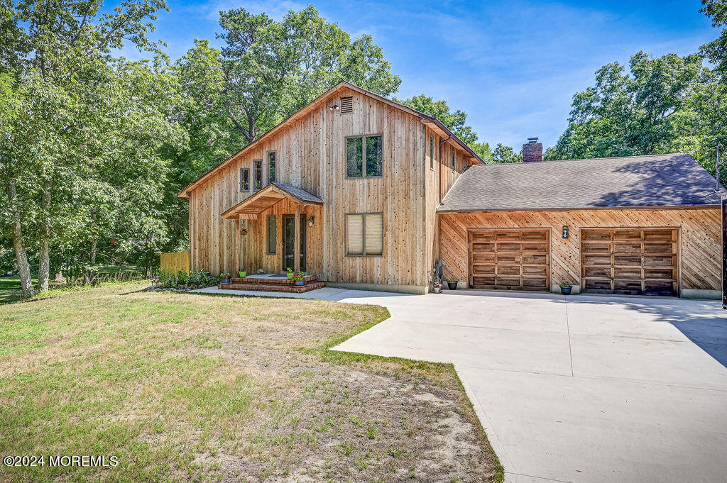 290 Easy Street Howell, NJ 07731 - Photo 3 of 43 a front view of a house with a yard