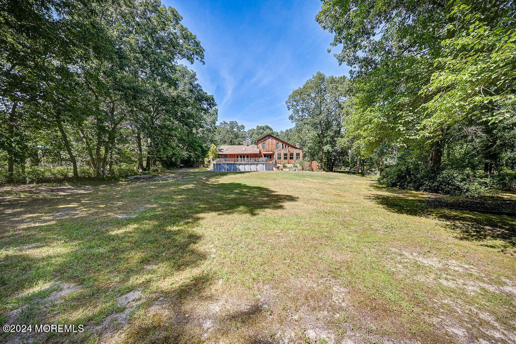 290 Easy Street Howell, NJ 07731 - Photo 32 of 43 a view of a field with some trees in the background
