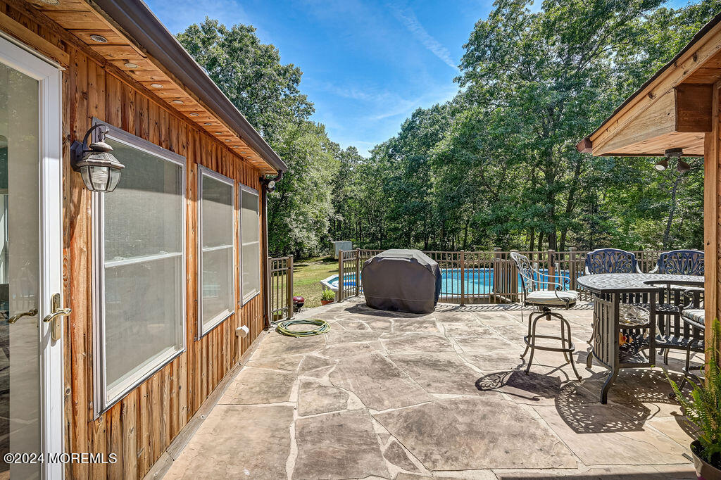 290 Easy Street Howell, NJ 07731 - Photo 40 of 43 a view of a chairs and table in the balcony