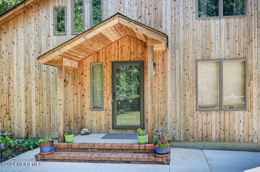 290 Easy Street Howell, NJ 07731 - Photo 4 of 43 a front view of a house with a garden