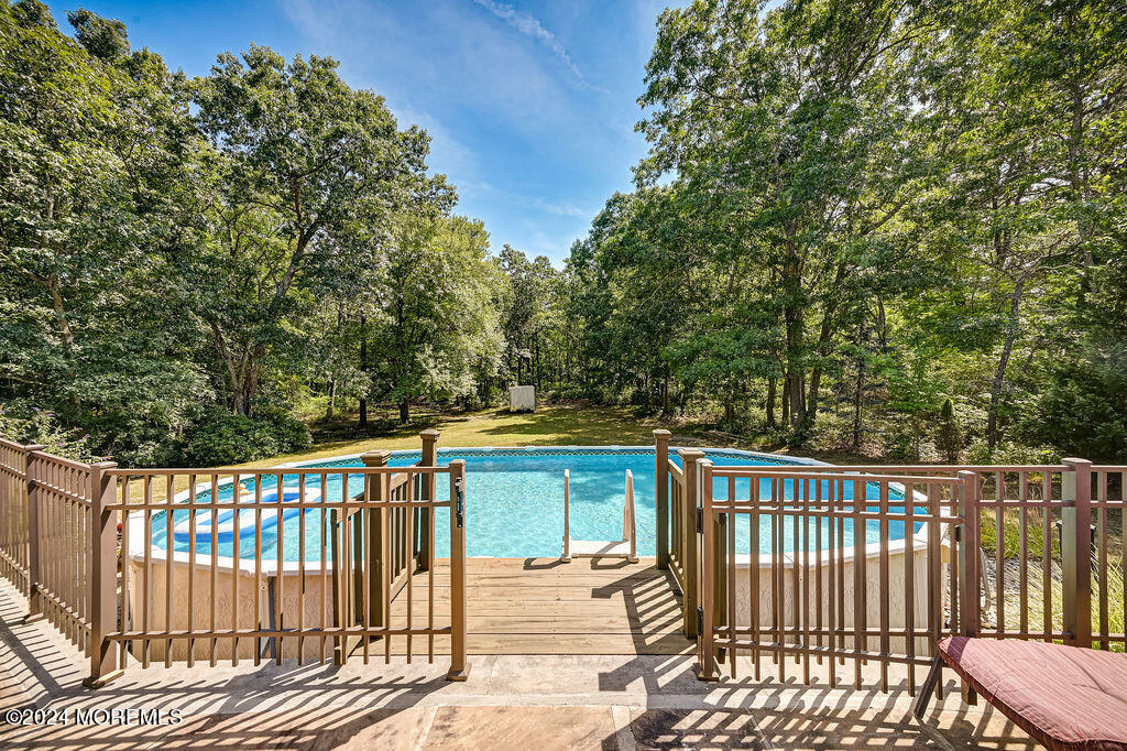 290 Easy Street Howell, NJ 07731 - Photo 42 of 43 a balcony with wooden floor and fence
