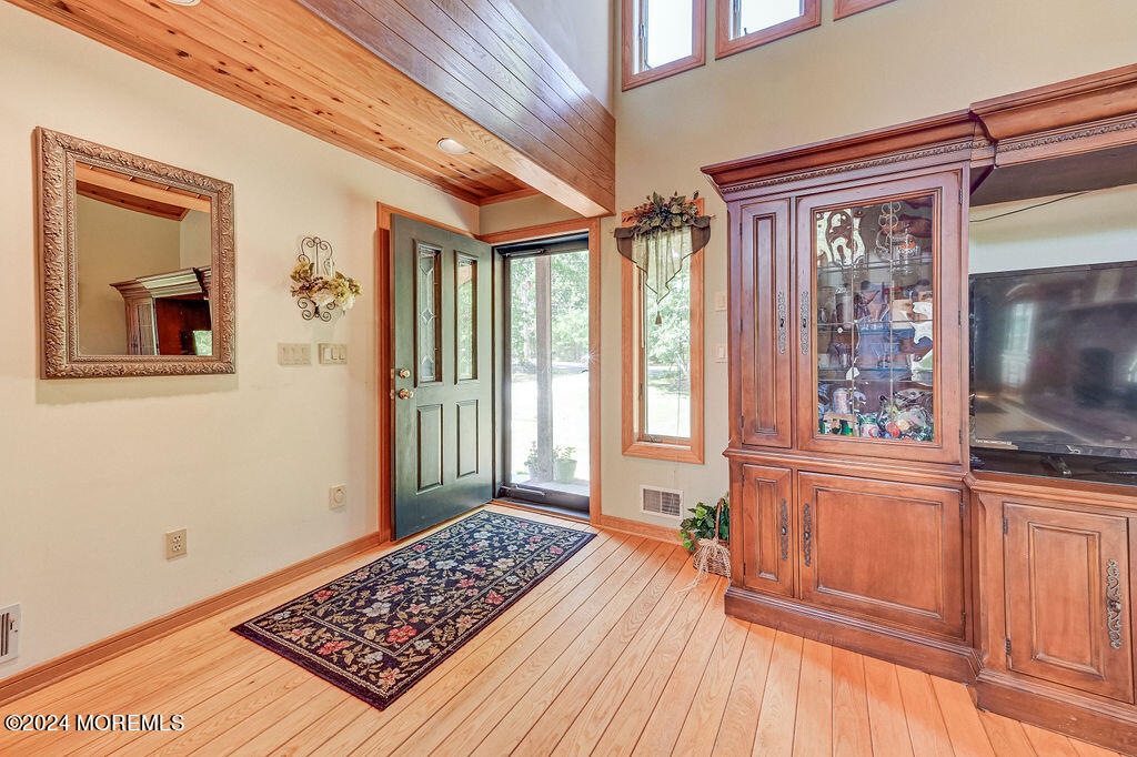 290 Easy Street Howell, NJ 07731 - Photo 5 of 43 a view of a bedroom with wooden floor and windows