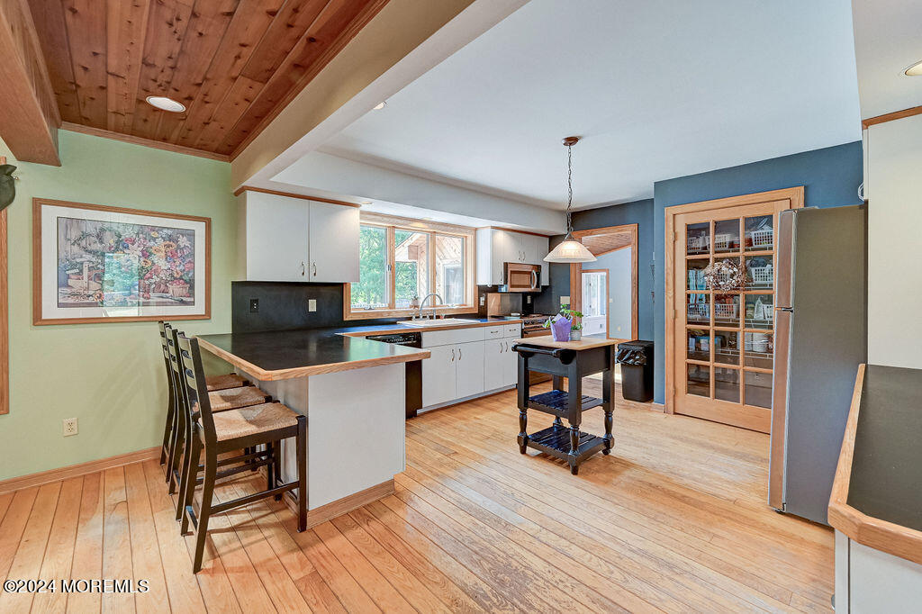 290 Easy Street Howell, NJ 07731 - Photo 9 of 43 a living room with furniture and a flat screen tv