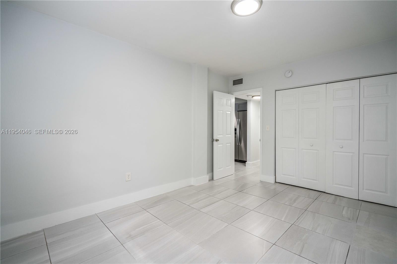 465 Northeast 59th Street, Unit 12 Miami, FL 33137 - Photo 13 of 17 a view of an empty room