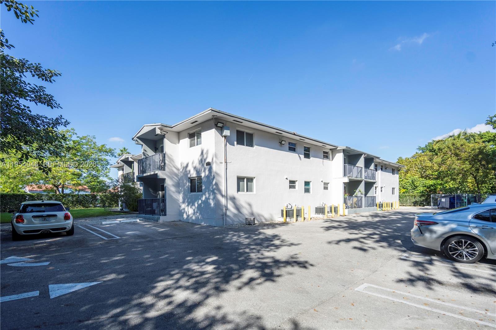 465 Northeast 59th Street, Unit 12 Miami, FL 33137 - Photo 16 of 17 a view of a car park in front of a house