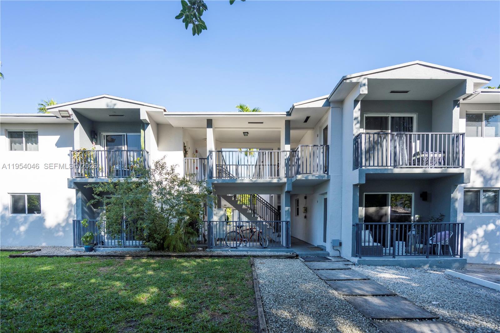 465 Northeast 59th Street, Unit 12 Miami, FL 33137 - Photo 3 of 17 a front view of a house with a yard