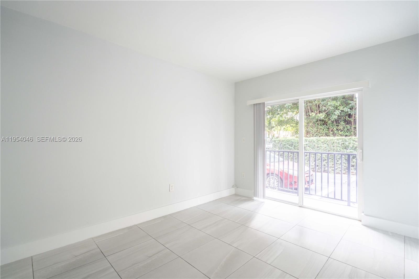 465 Northeast 59th Street, Unit 12 Miami, FL 33137 - Photo 7 of 17 a view of an empty room with a window