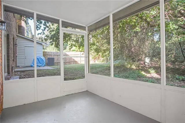 a view of a room that has a bed