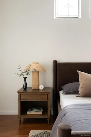 a bedroom with a bed and a table