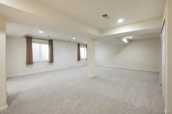 a view of an empty room with windows