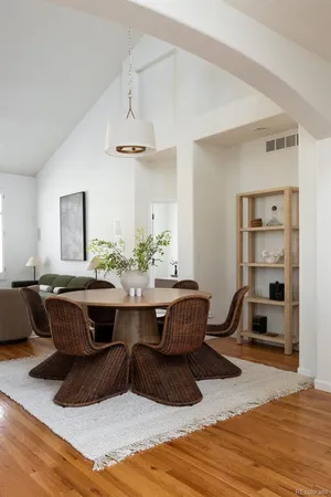 a living room with a couch and a chandelier
