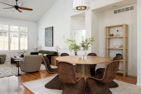 a view of a dining room with furniture window and wooden floor